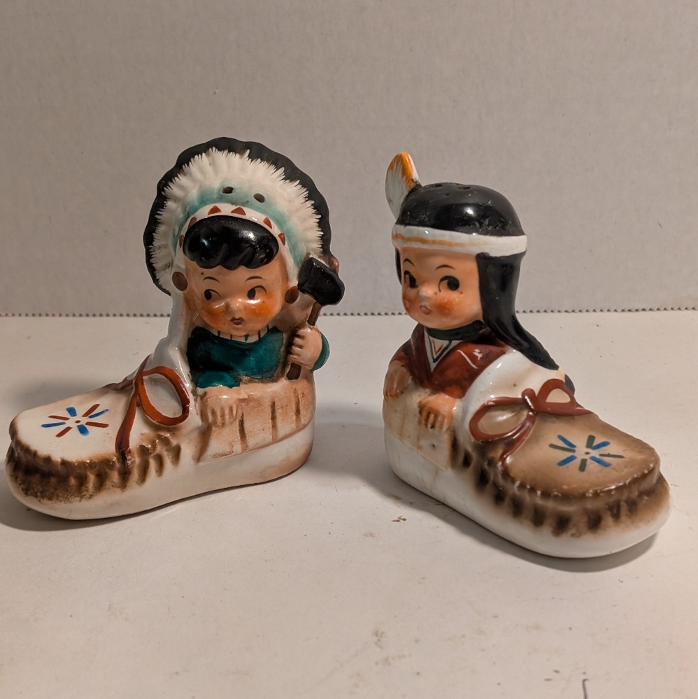 Vintage Native American Boy And Girl In Moccasins Salt & Pepper Shaker Set.